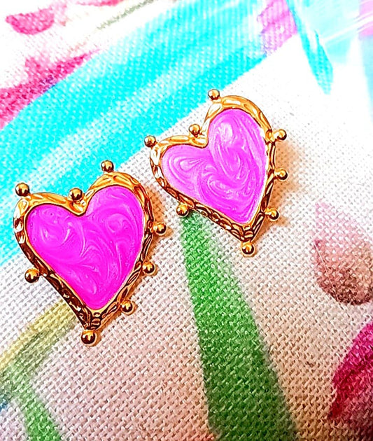 Pink earrings in a shape of heart